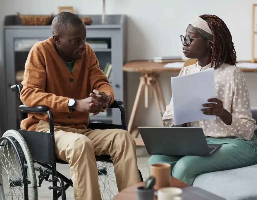 Human Services Worker Discussing Social Services with Client